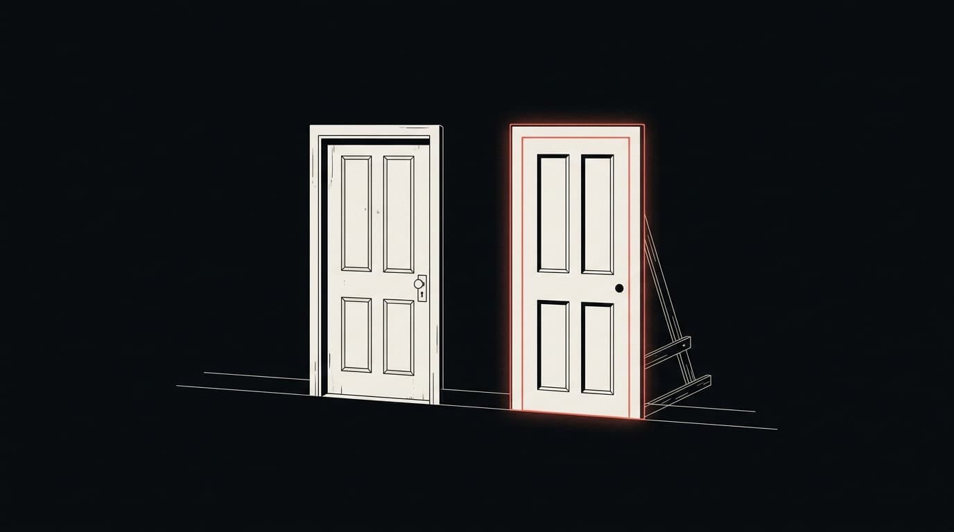 Two nearly identical doors side by side; the one on the right is a flat facade propped up by struts, its frame glowing red.